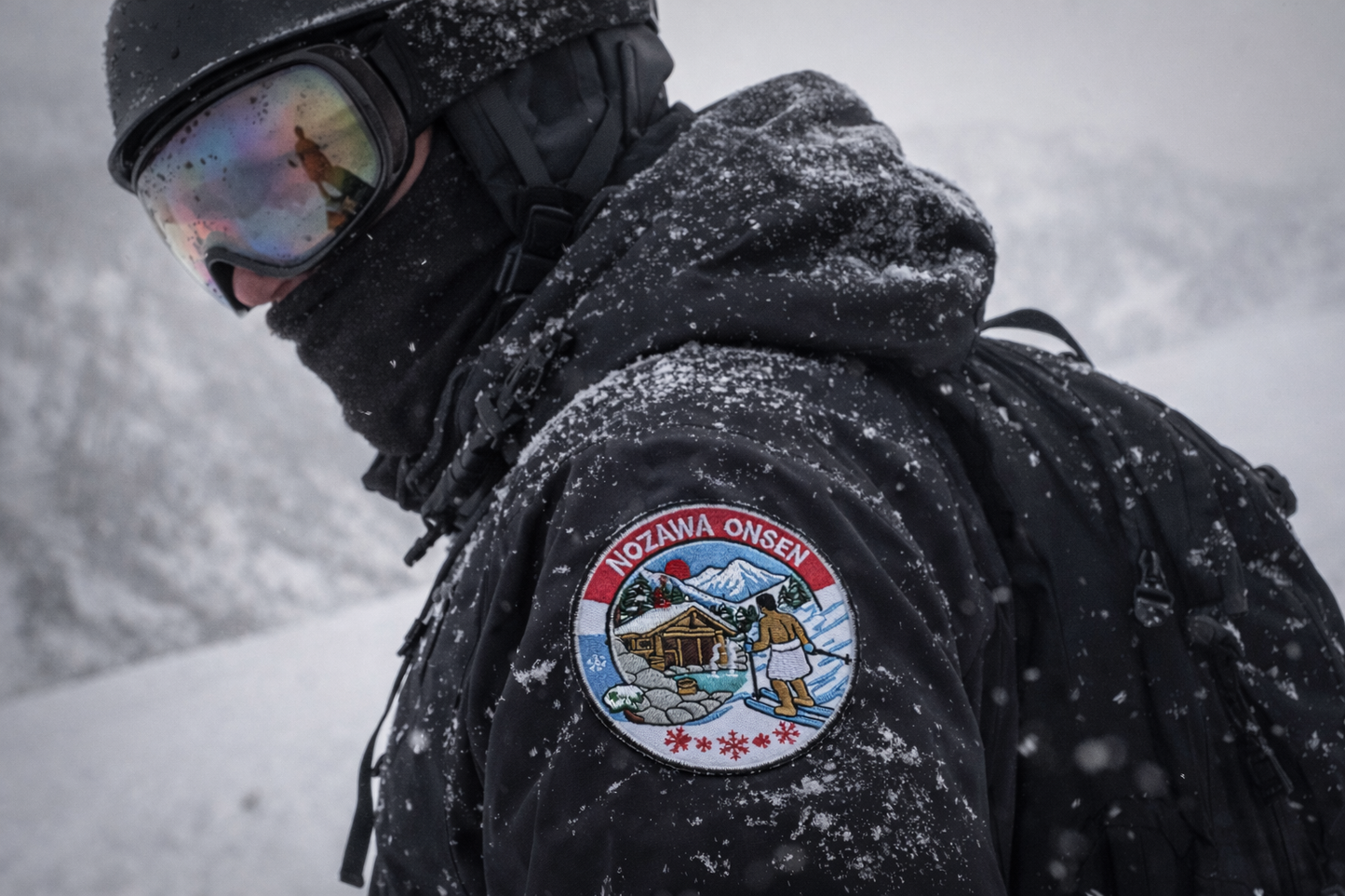 Snowboarder wearing Nozawa Onsen Ski Patch on their Shoulder